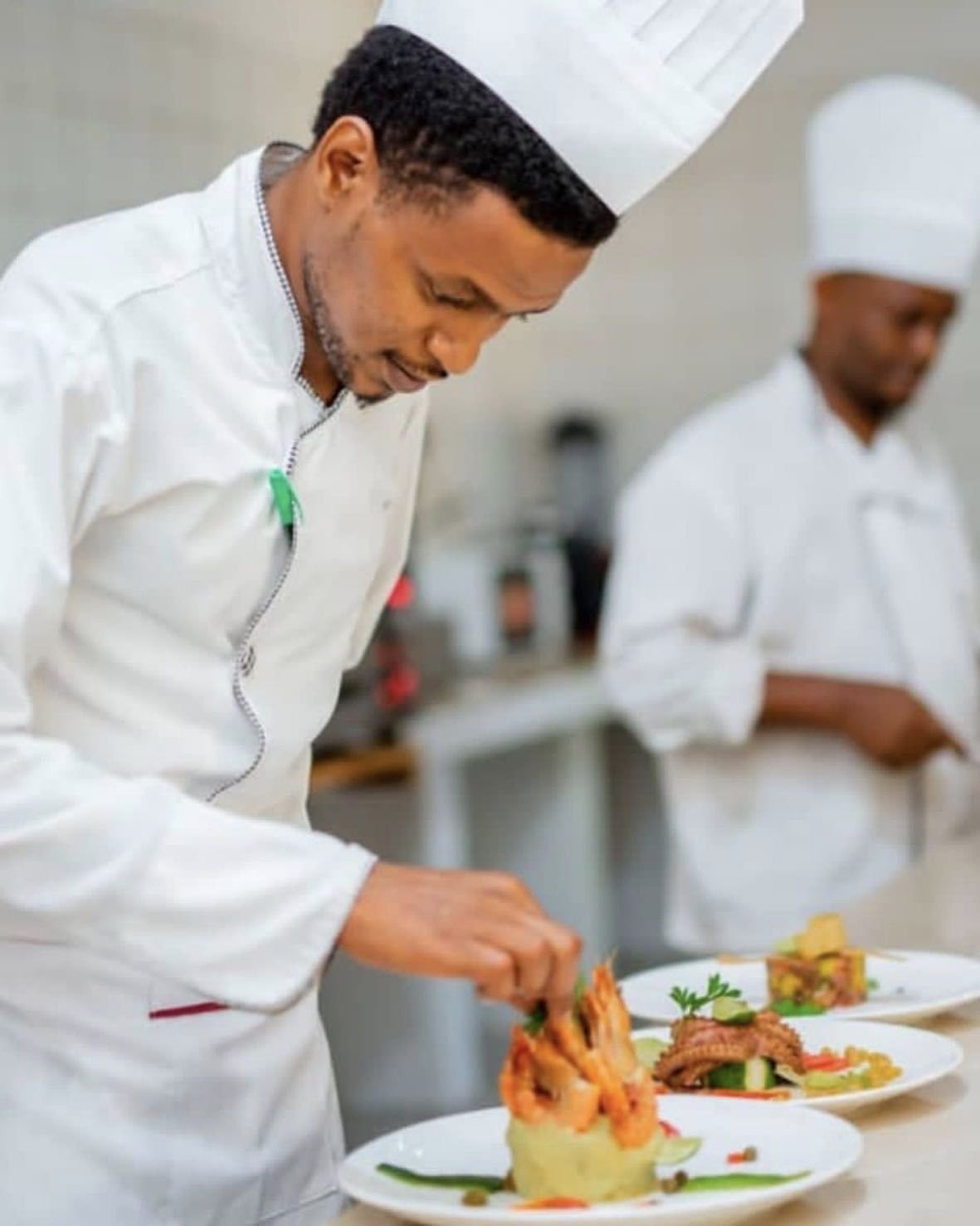 Kasha chefs plating dishes in the kitchen