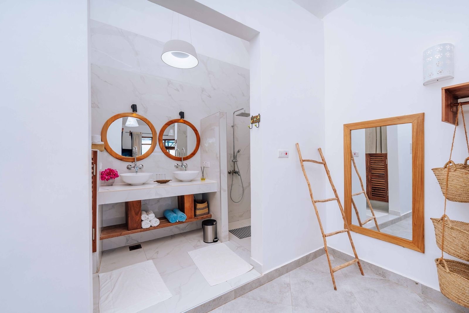 First Floor Sea View Room bathroom with twin round mirrors and a walk-in shower