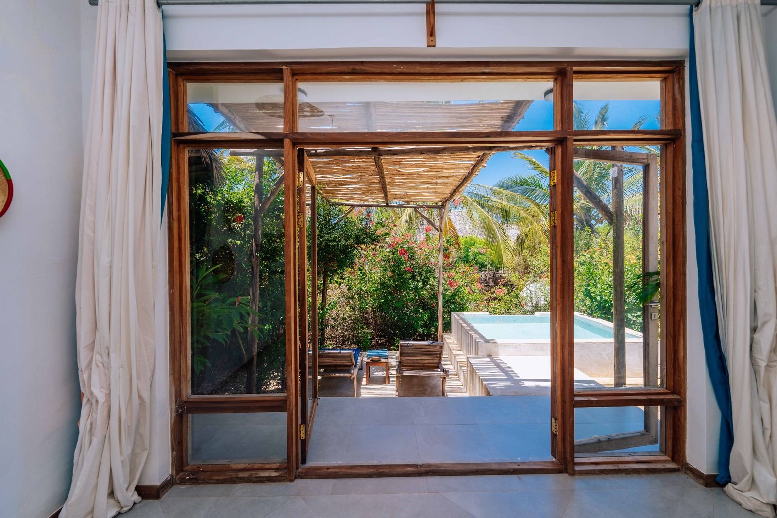 Garden Room glass doors opening onto a terrace with a private plunge pool