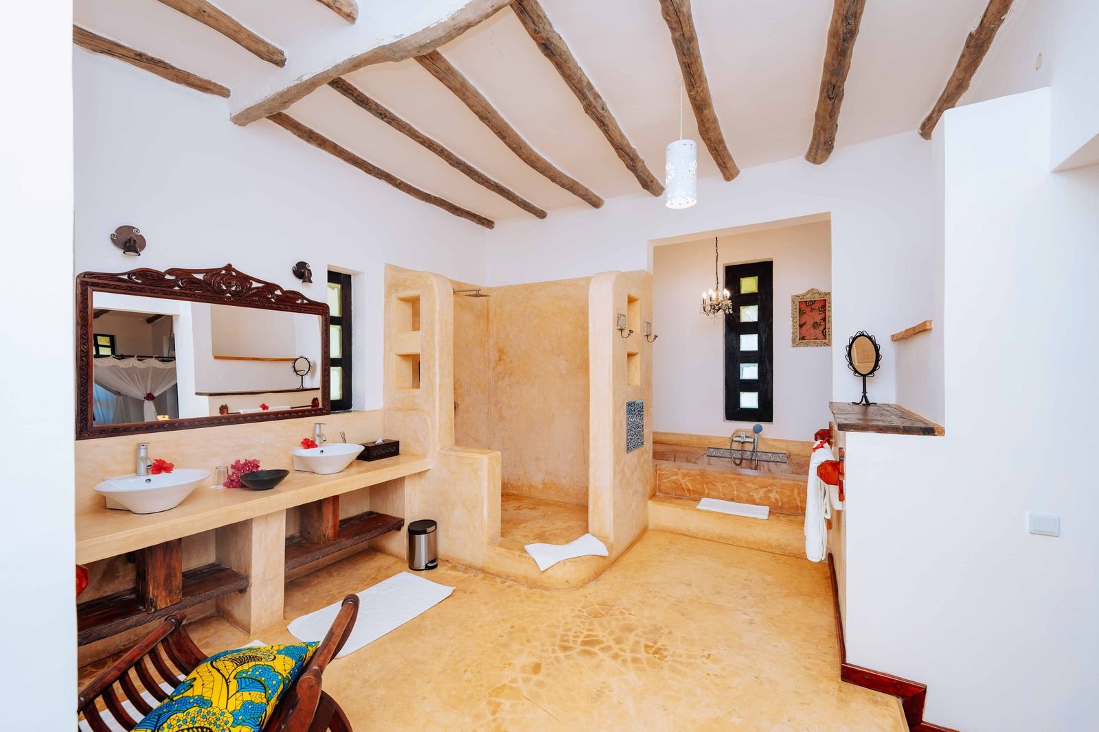 Sea Front Villa bathroom with twin basins and a stone shower